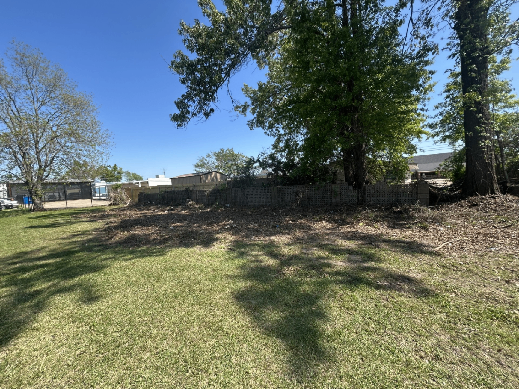 Cleared lot with fresh-cut grass after land clearing